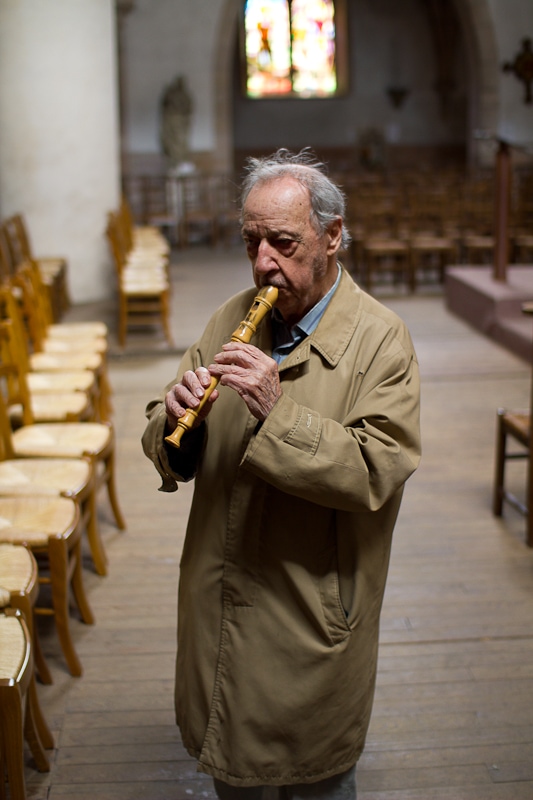 Old man playing flute